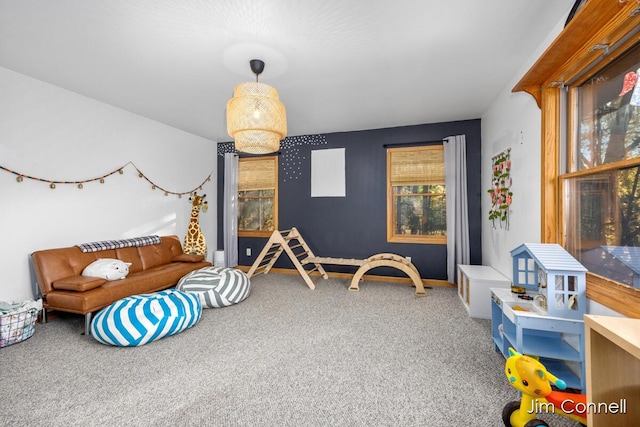 rec room with carpet floors and a wealth of natural light