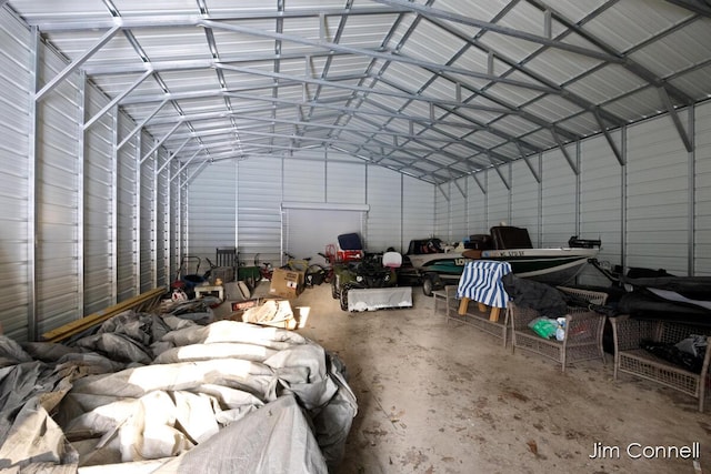 miscellaneous room featuring lofted ceiling and concrete floors