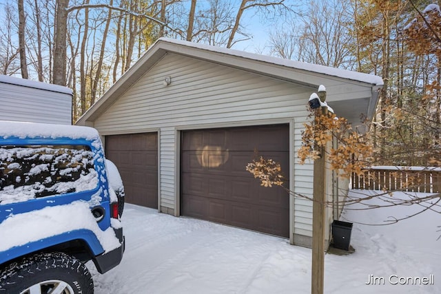 view of snow covered garage