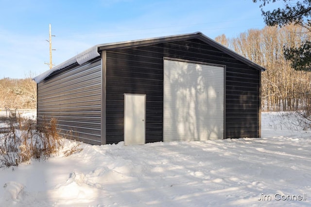 view of snow covered garage