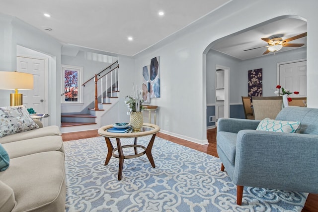 living room with hardwood / wood-style flooring and ceiling fan