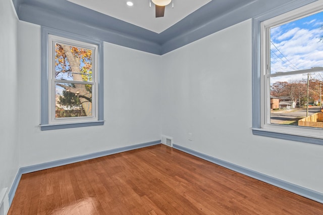 empty room featuring ceiling fan and wood-type flooring