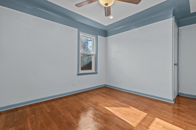 unfurnished room with ceiling fan and wood-type flooring