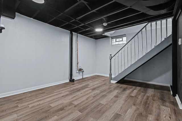 basement featuring hardwood / wood-style floors