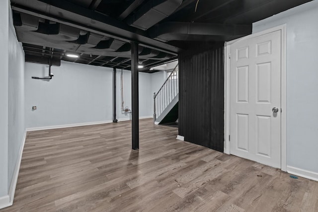 basement featuring hardwood / wood-style flooring