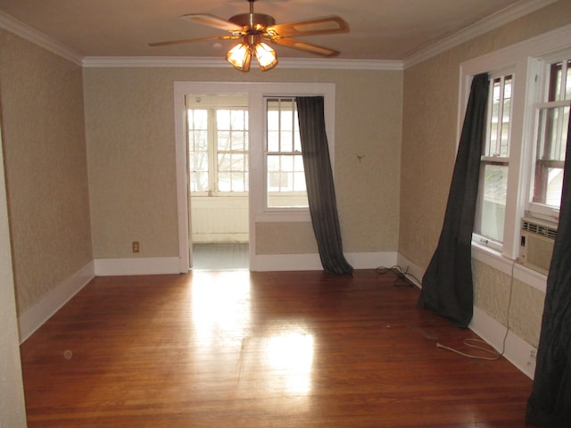 empty room featuring ceiling fan, crown molding, cooling unit, and hardwood / wood-style flooring