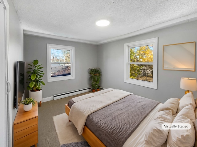 carpeted bedroom featuring multiple windows, a baseboard radiator, and a textured ceiling