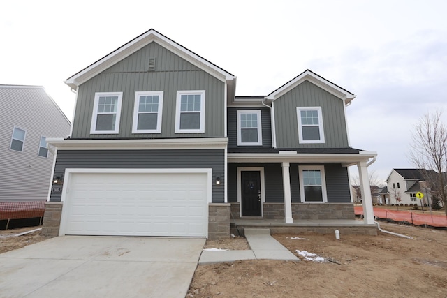 view of front of property featuring a garage and a porch