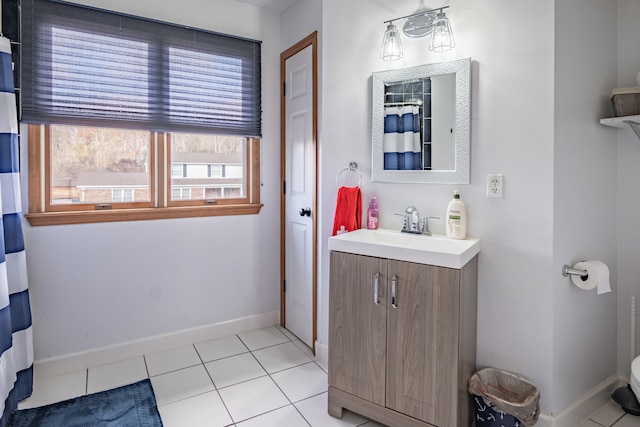 bathroom with tile patterned floors and vanity