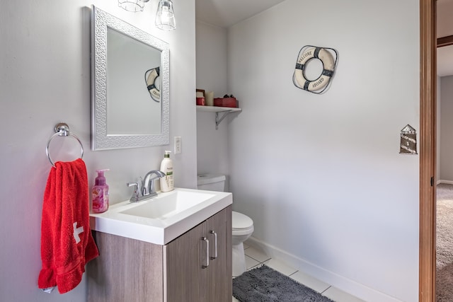 bathroom featuring tile patterned flooring, vanity, and toilet