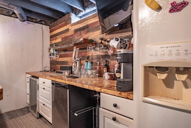 kitchen featuring wine cooler, white cabinets, and wooden counters