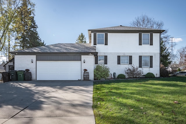 front of property featuring a front yard and a garage