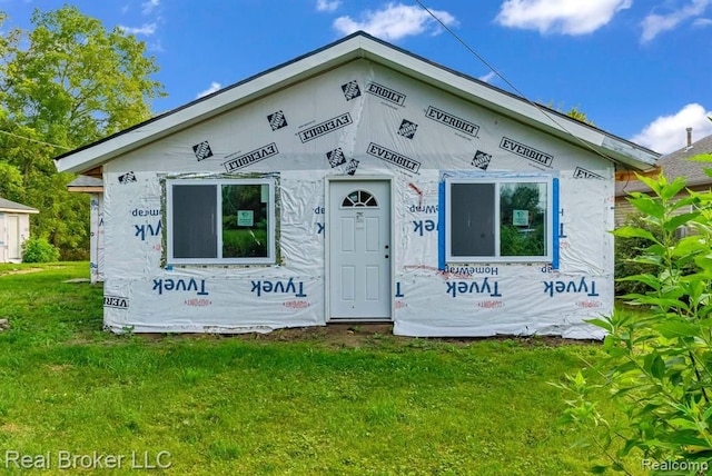 unfinished property with a front yard