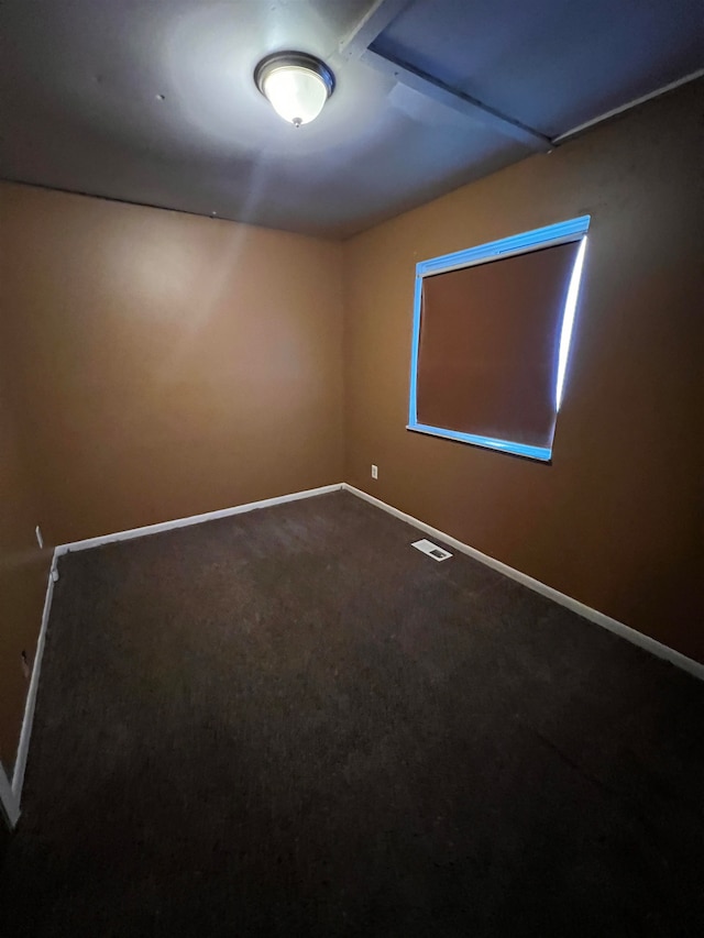 unfurnished room with carpet floors