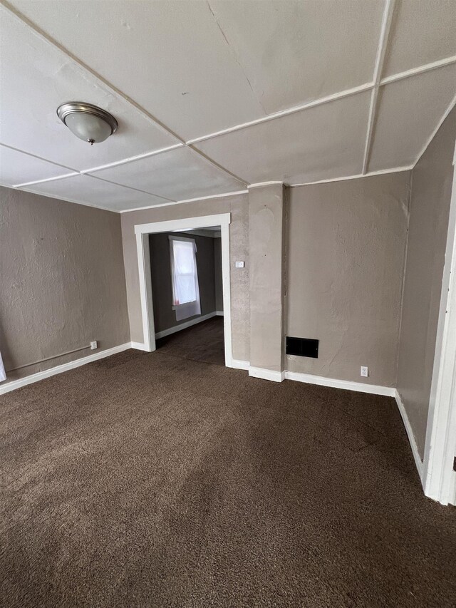 820 Vermilya Ave, Flint, MI 48507 - spare room with carpet flooring, baseboards, and a textured wall