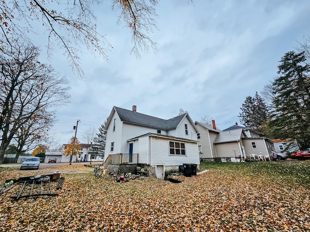 view of side of property with a deck