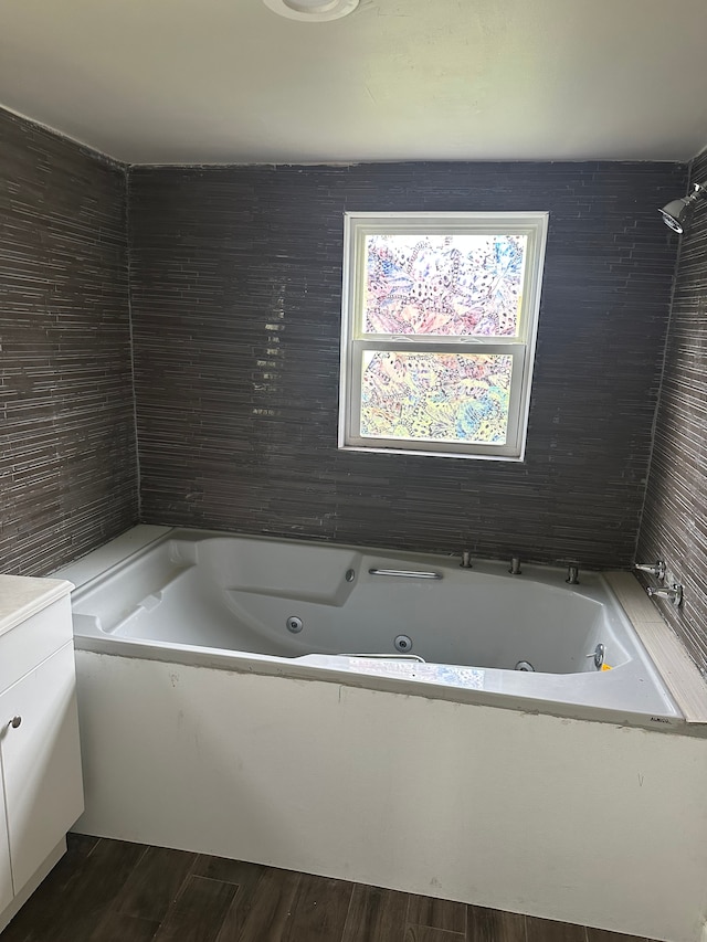 bathroom with hardwood / wood-style floors