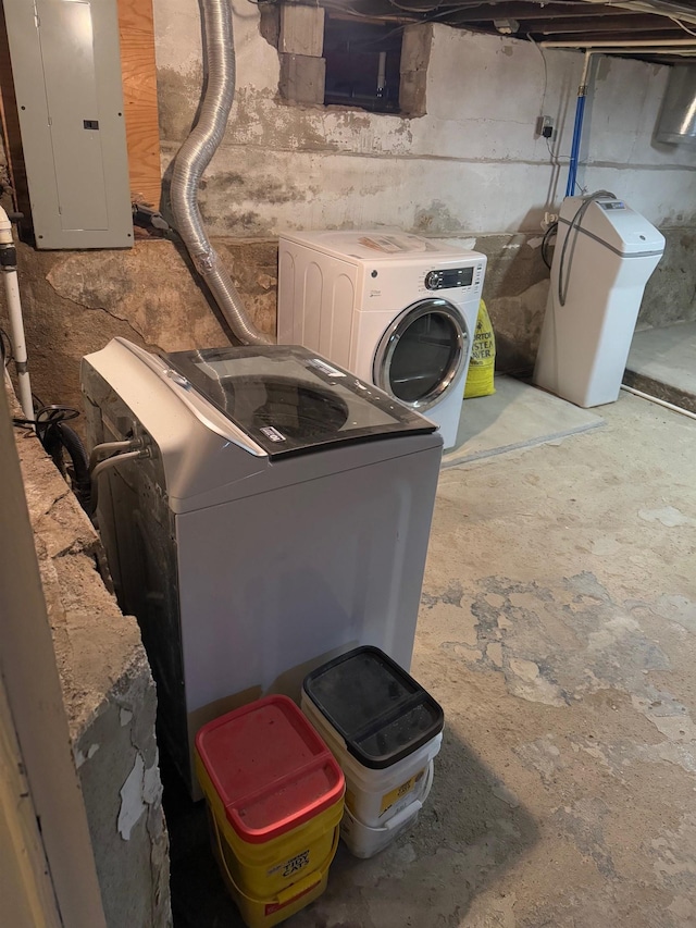 basement featuring electric panel and washer / clothes dryer