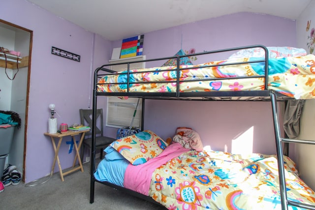 carpeted bedroom featuring lofted ceiling