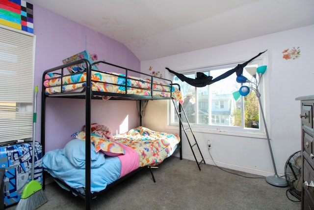 carpeted bedroom with vaulted ceiling