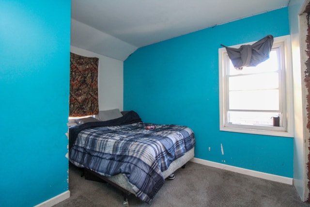 carpeted bedroom featuring vaulted ceiling