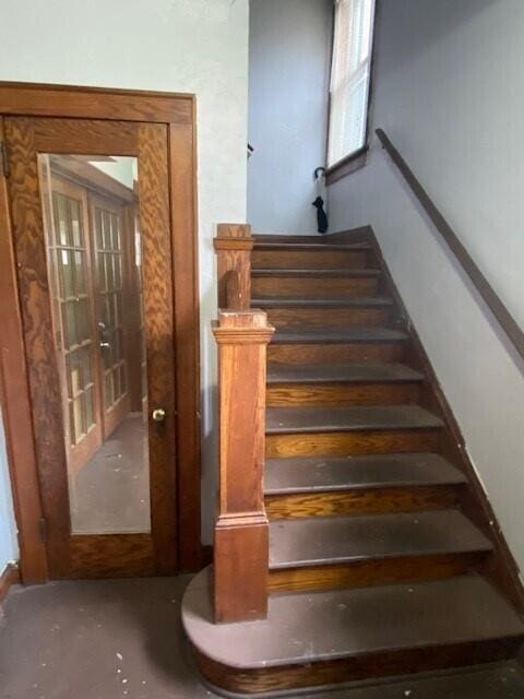 staircase with french doors