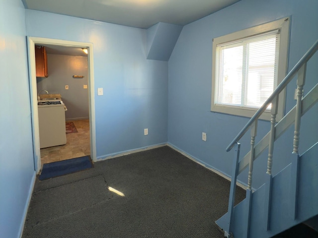 additional living space featuring dark carpet and sink