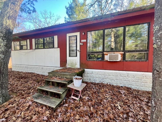 8207 W Columbine, Baldwin, MI 49304 - view of exterior entry featuring cooling unit
