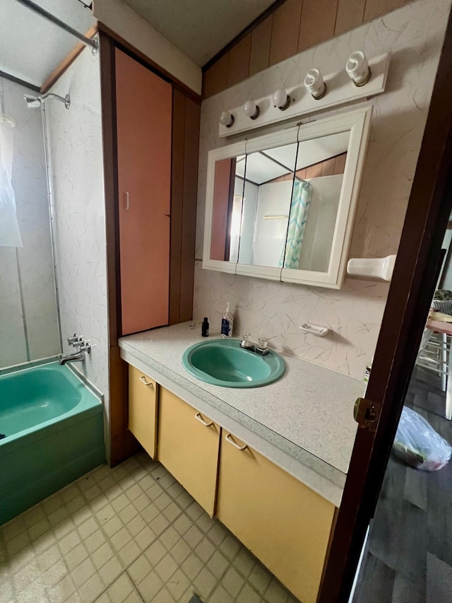 bathroom with vanity and bathtub / shower combination