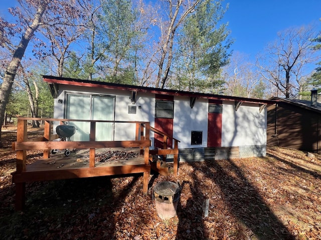 8207 W Columbine, Baldwin, MI 49304 - rear view of property featuring a deck