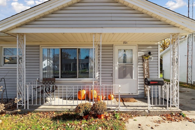 view of exterior entry featuring a porch