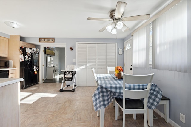 dining room featuring ceiling fan