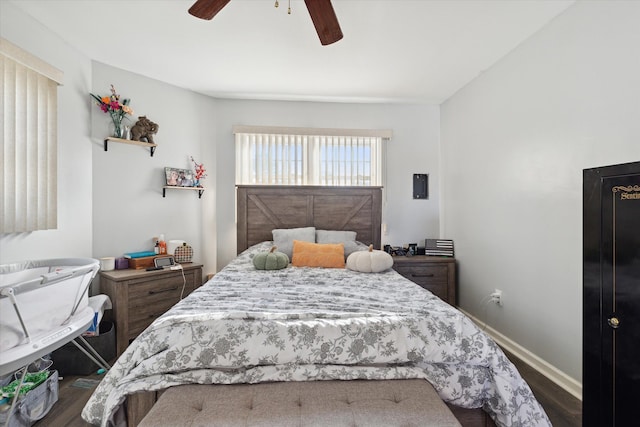 bedroom featuring dark hardwood / wood-style floors and ceiling fan