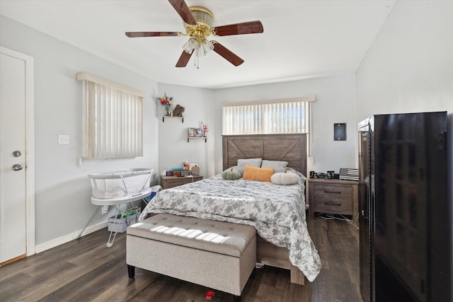 bedroom featuring dark hardwood / wood-style flooring and ceiling fan