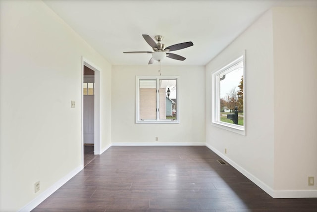 unfurnished room featuring ceiling fan and dark hardwood / wood-style flooring