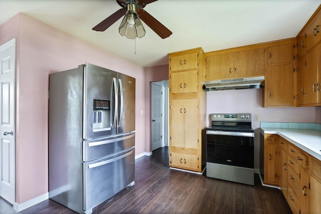 kitchen featuring stainless steel appliances, dark hardwood / wood-style floors, and ceiling fan