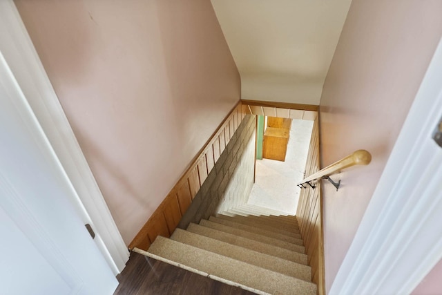 stairs featuring wood-type flooring