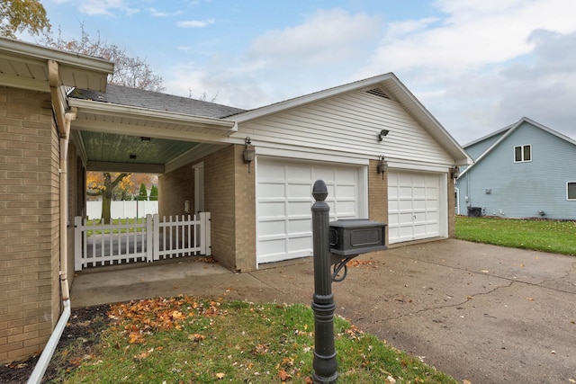 view of side of home with a garage