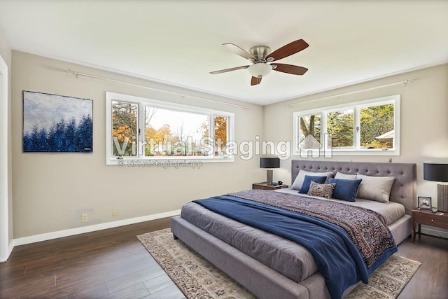 bedroom featuring ceiling fan and dark wood-type flooring