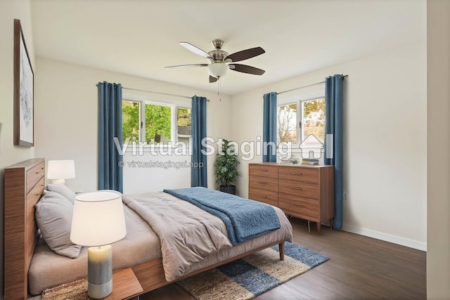 bedroom featuring multiple windows, ceiling fan, and dark hardwood / wood-style flooring