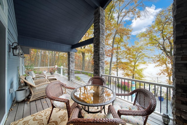 wooden deck featuring outdoor dining space