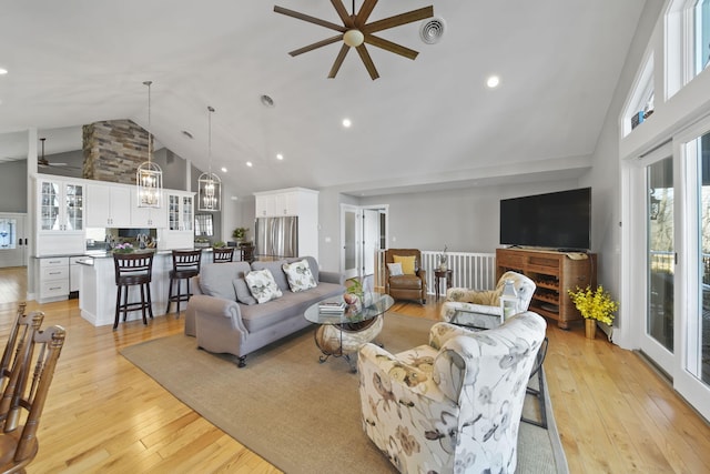 living room with visible vents, high vaulted ceiling, a ceiling fan, recessed lighting, and light wood-style floors