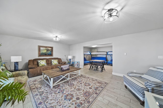 living area with baseboards and light wood-style floors