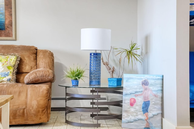 living area featuring a baseboard heating unit