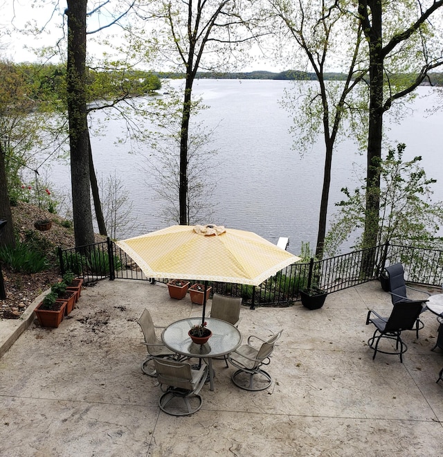 view of patio with a water view