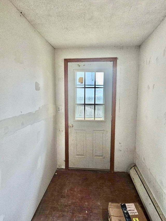 doorway with a baseboard heating unit