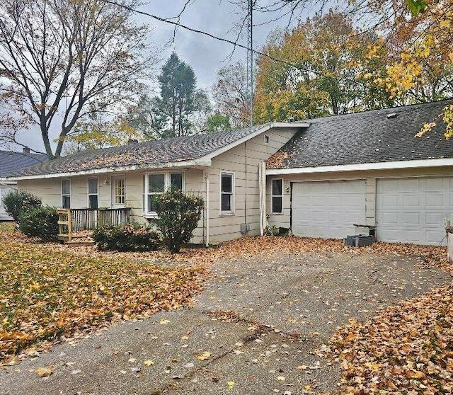 back of property with a garage