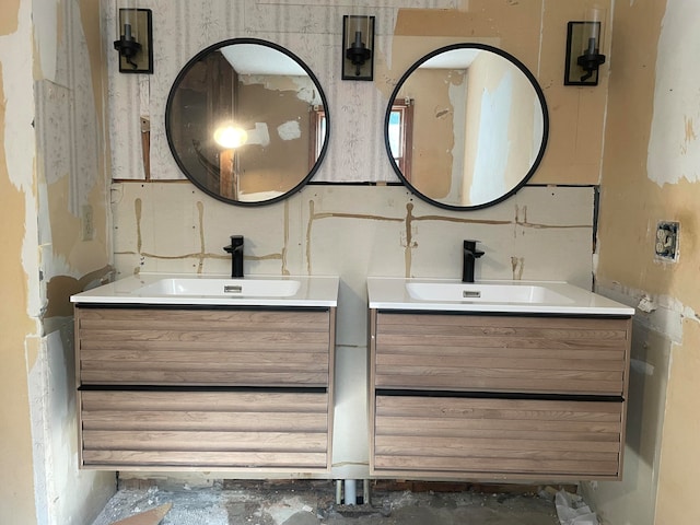 bathroom with vanity and concrete floors