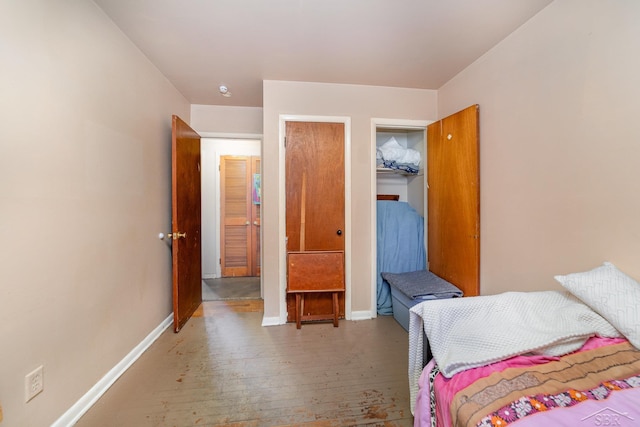 bedroom featuring hardwood / wood-style flooring and a closet