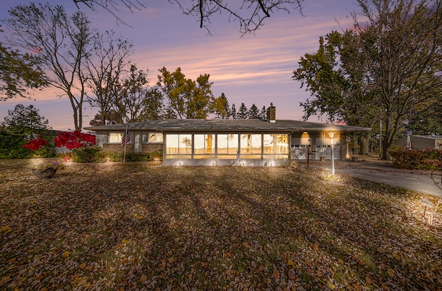 view of front of home featuring a carport